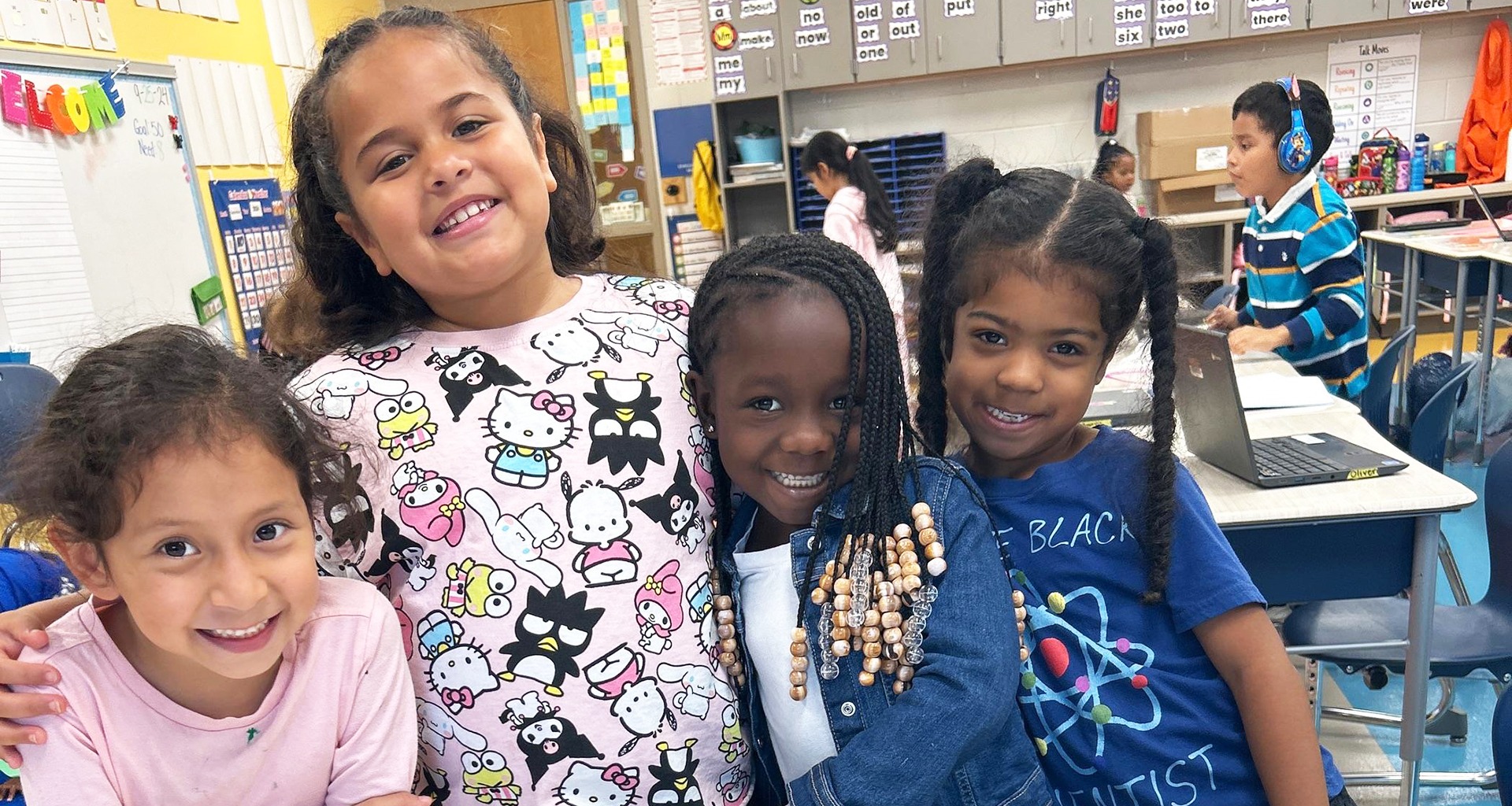 Four students pose for a photo