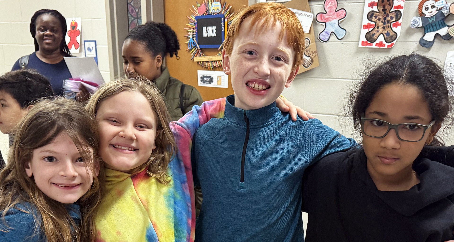 Four students pose for a photo