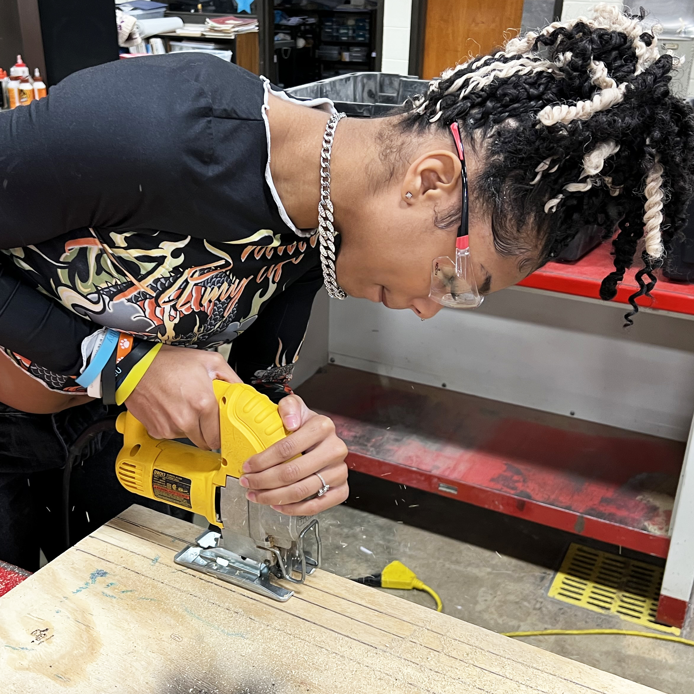 student sawing