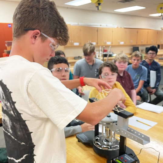 student demonstrating equipement