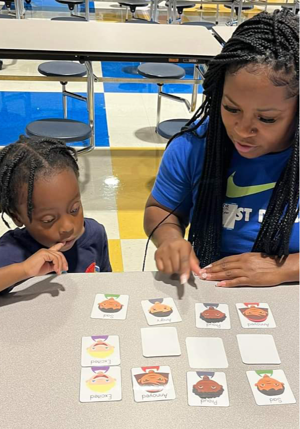Teacher helping a student