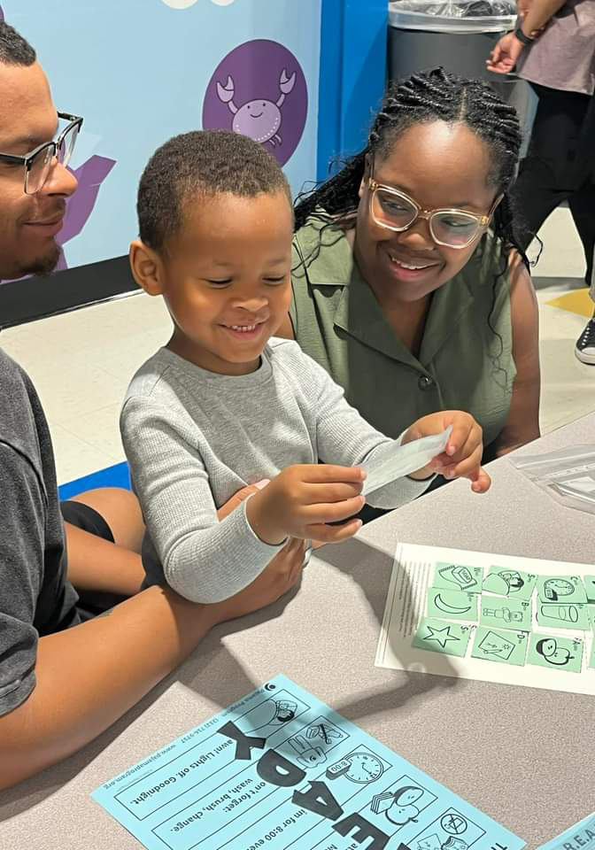 Parents playing game with their student