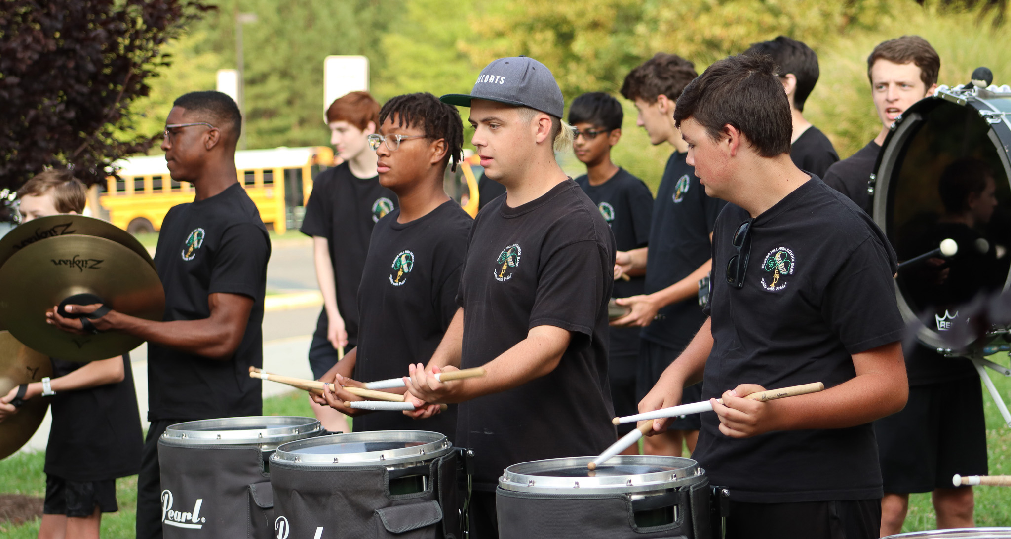 Drumline performing in front of the school