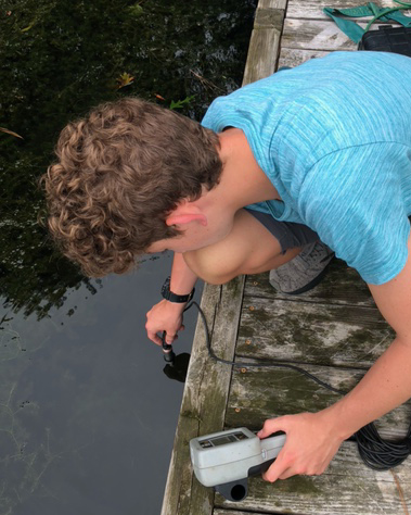 Student taking readings on water