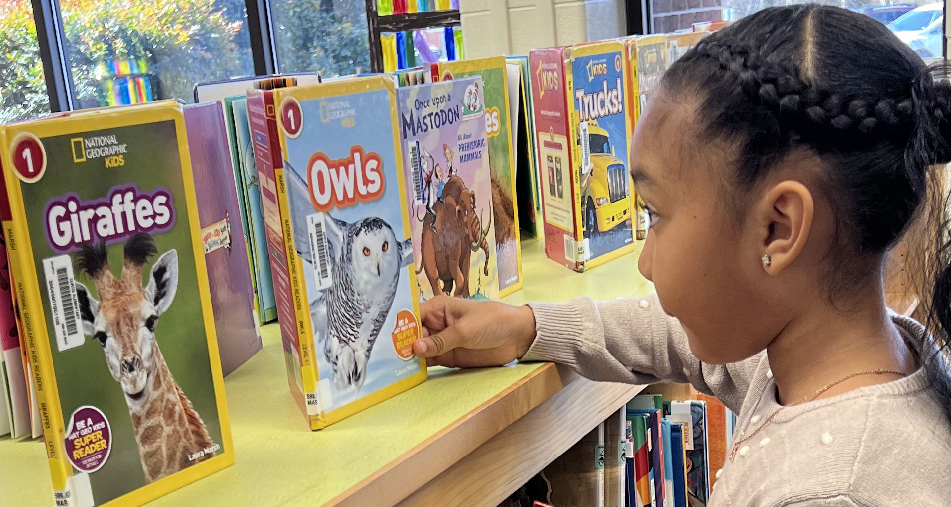 Student selecting a book