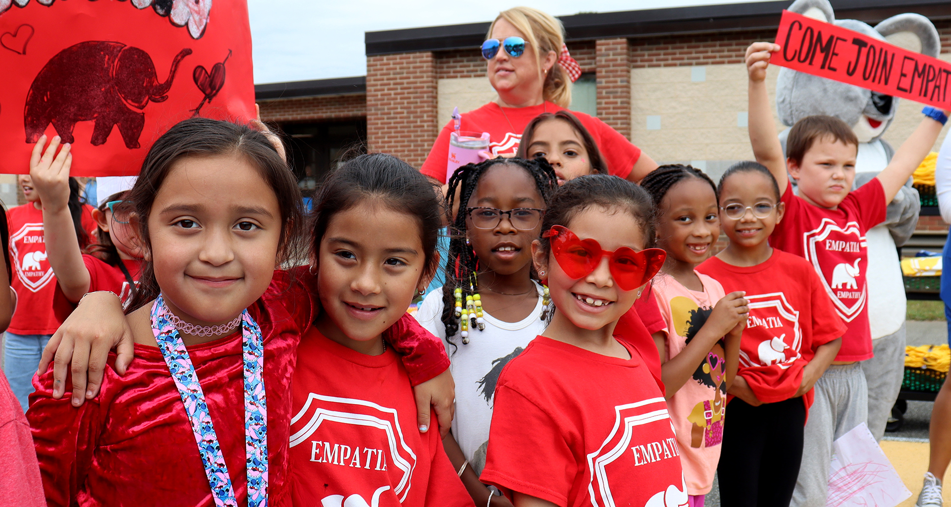 Students dressed in red during house ceremony