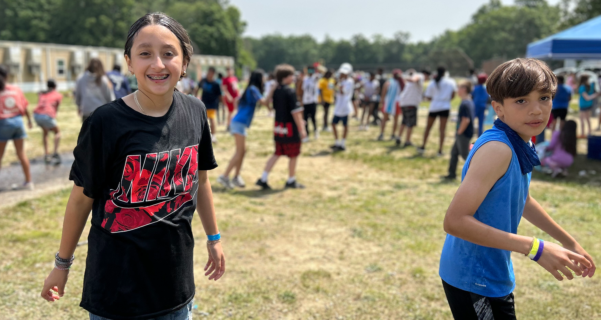 students laughing outside during field day.