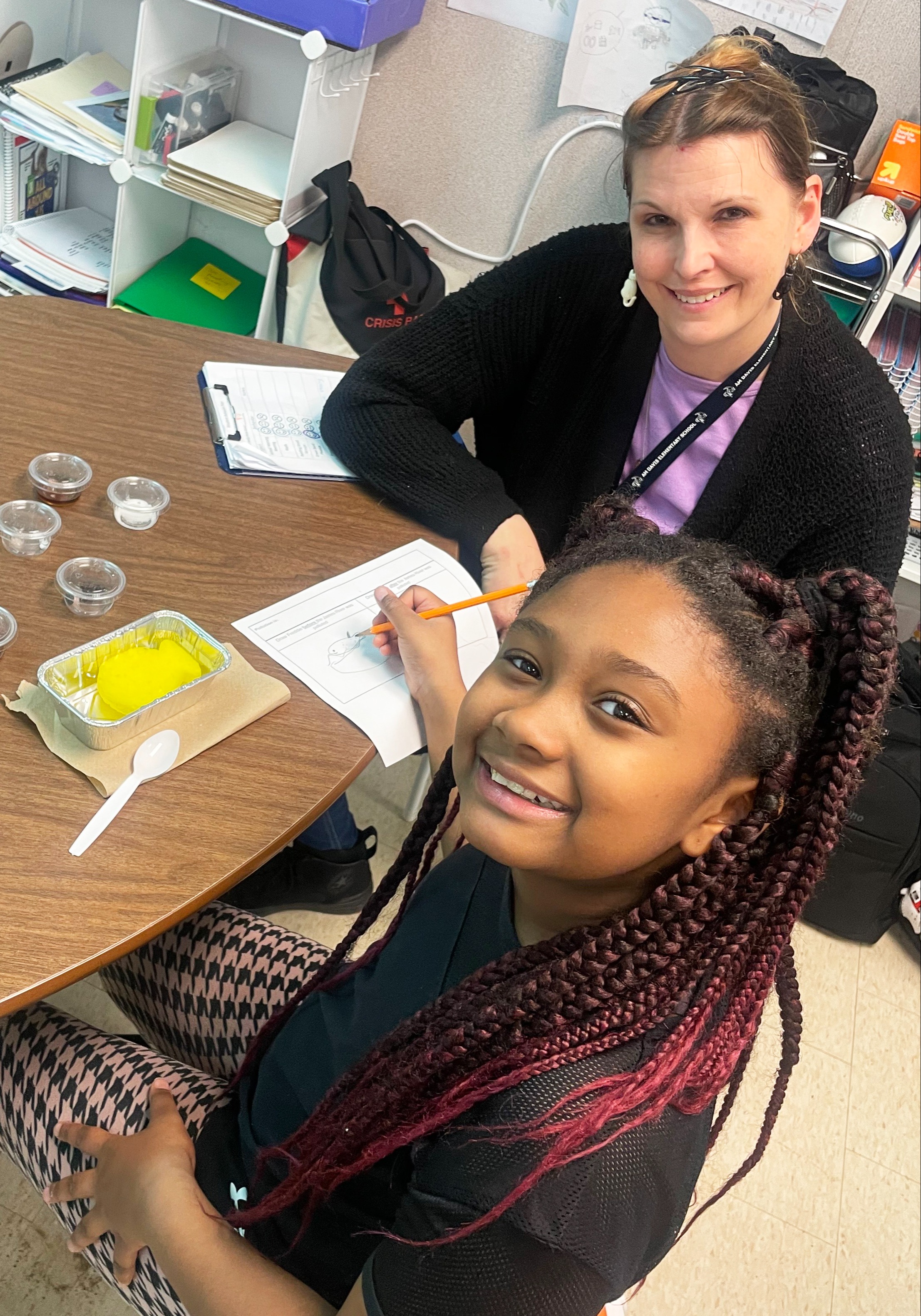a student and teacher working together