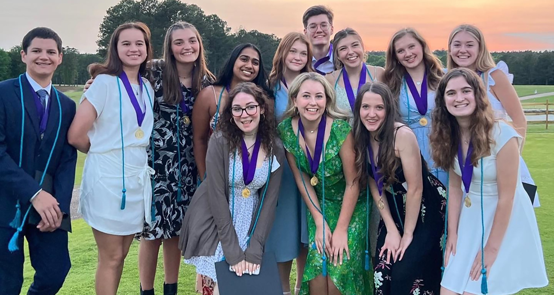 Several students pose for a selfie.