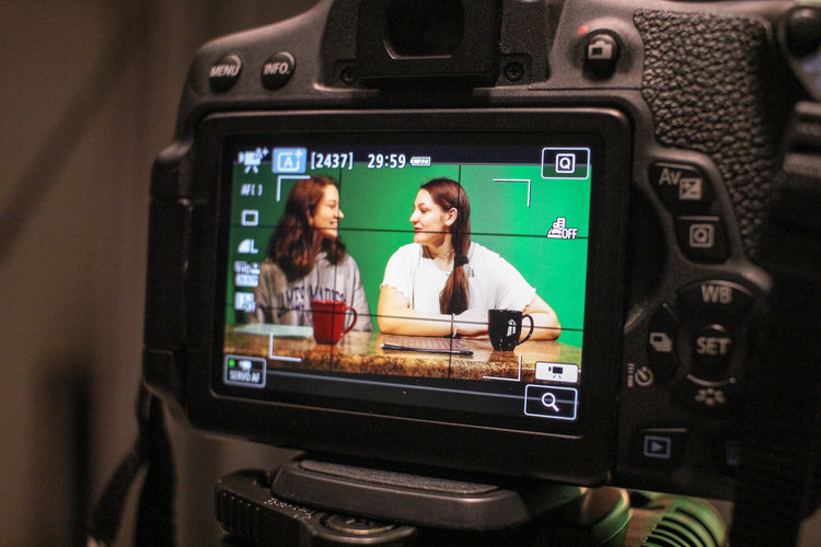 Two students one interviewing other