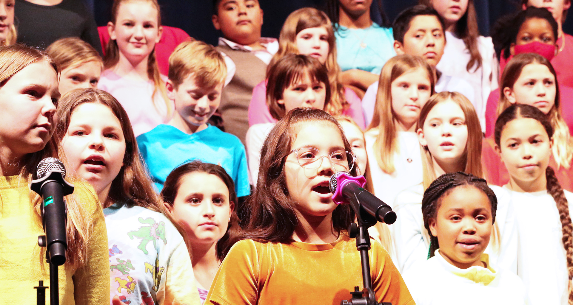 Students singing together during a performance