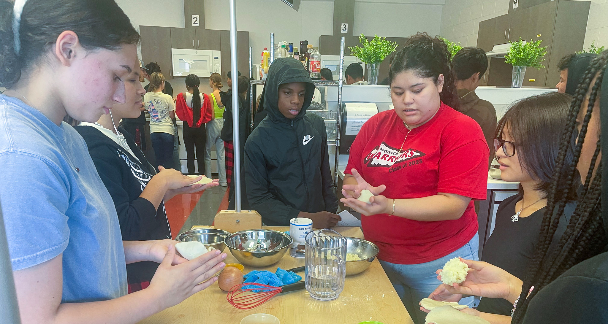 Students making food during a class