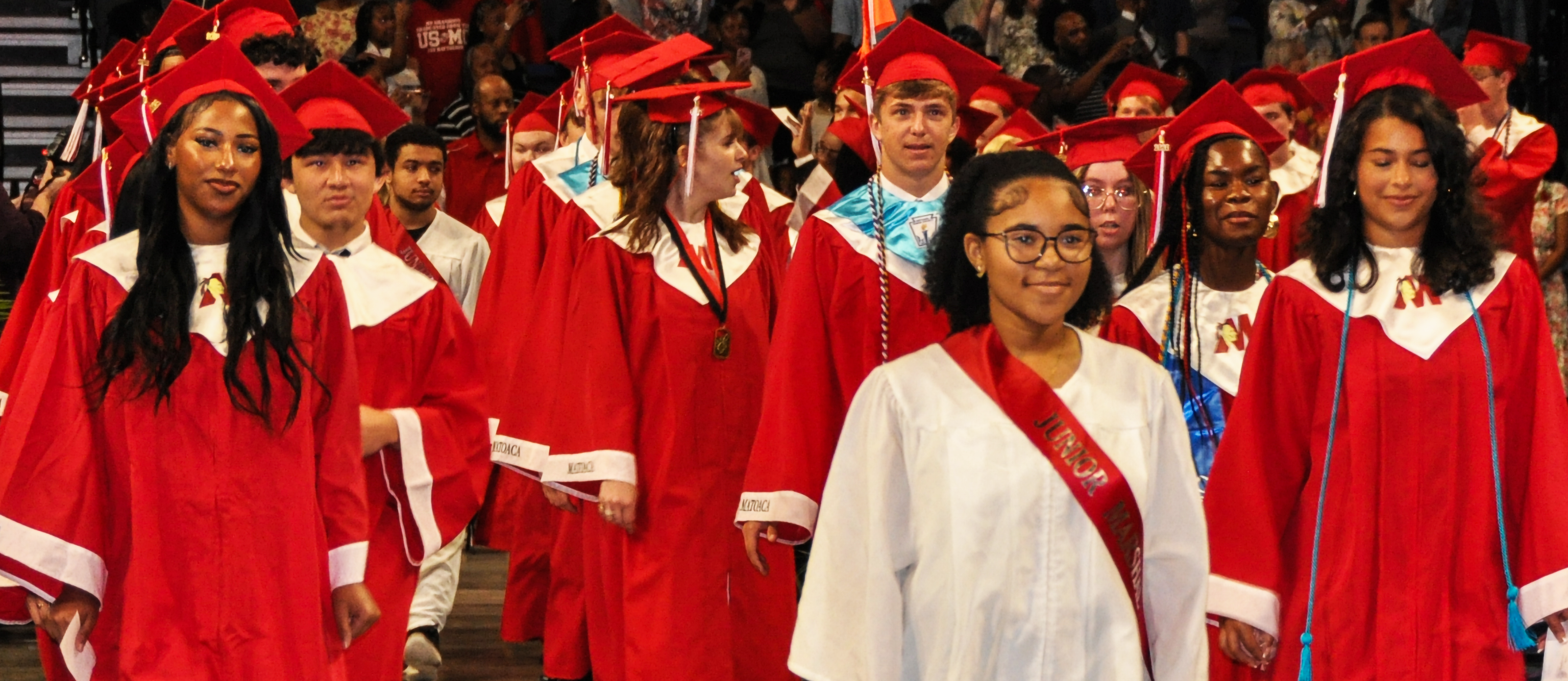 graduates smile for the camera