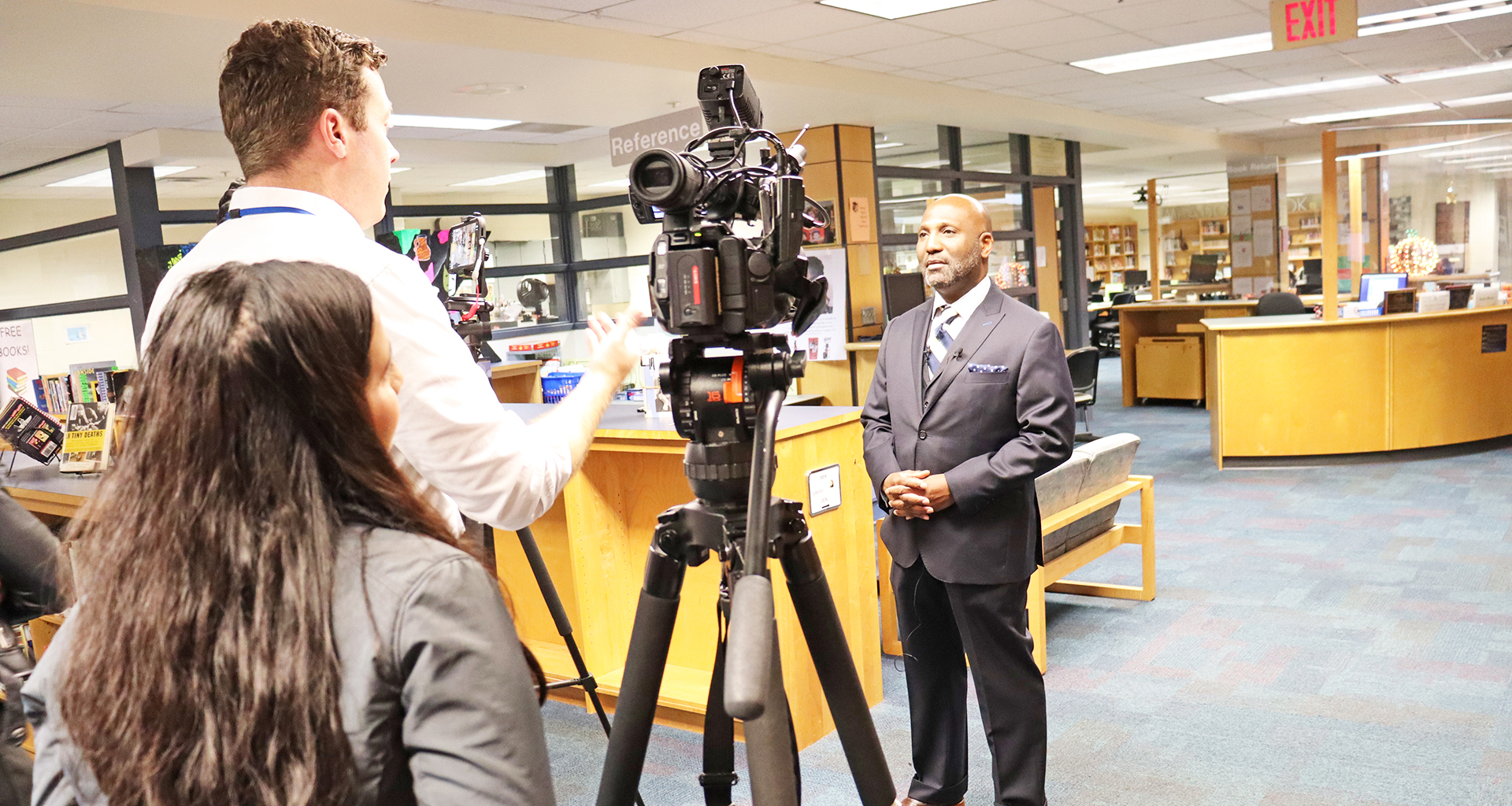 Principal being filmed by students