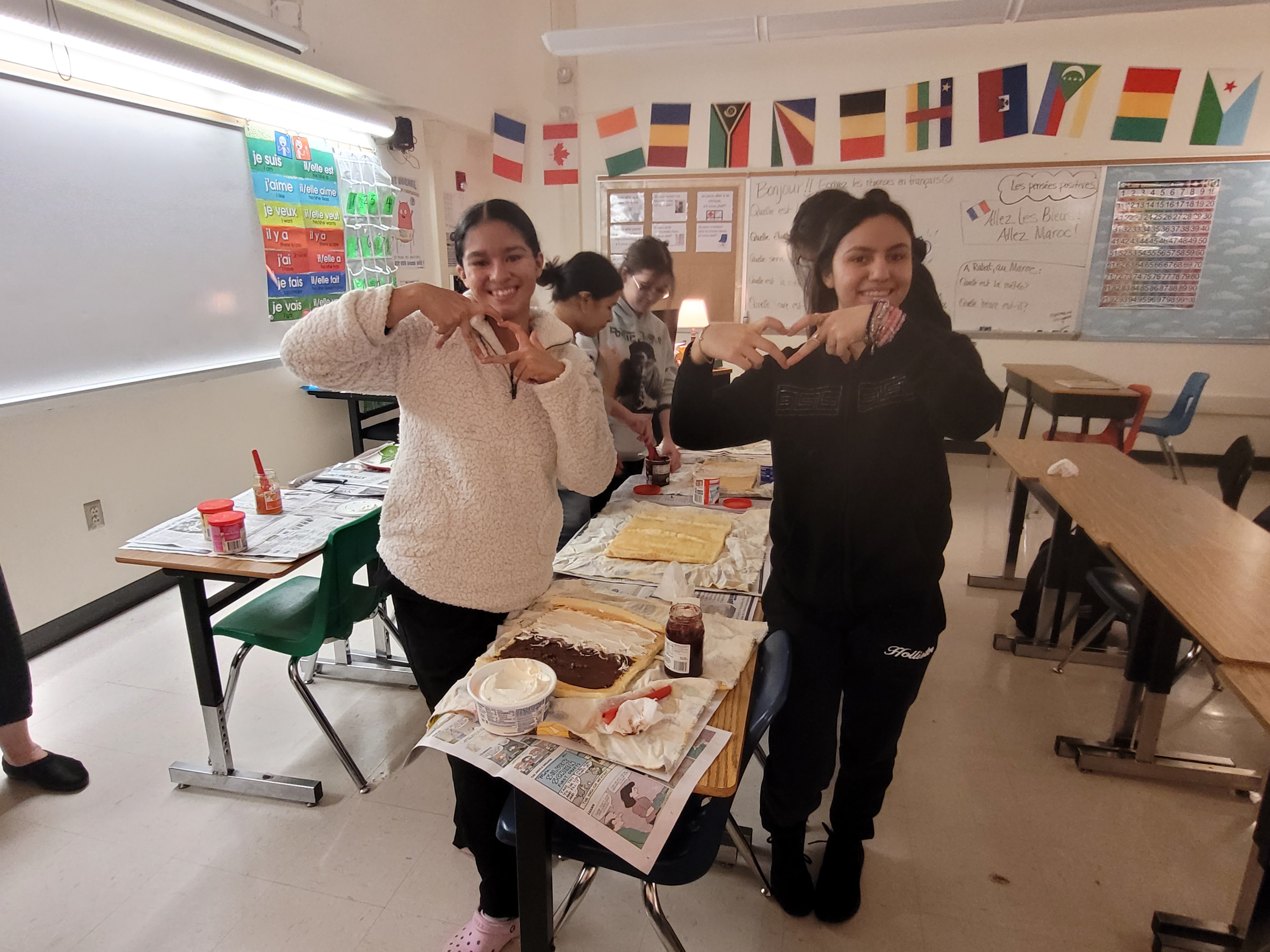 Students making heart hands