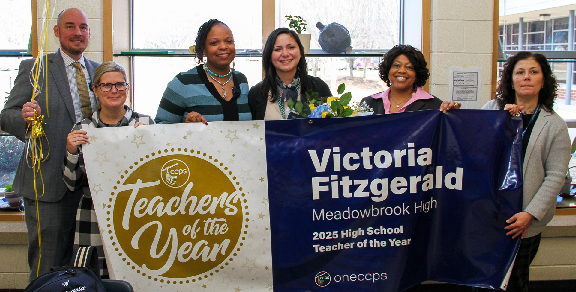 leadership poses with teacher of the year