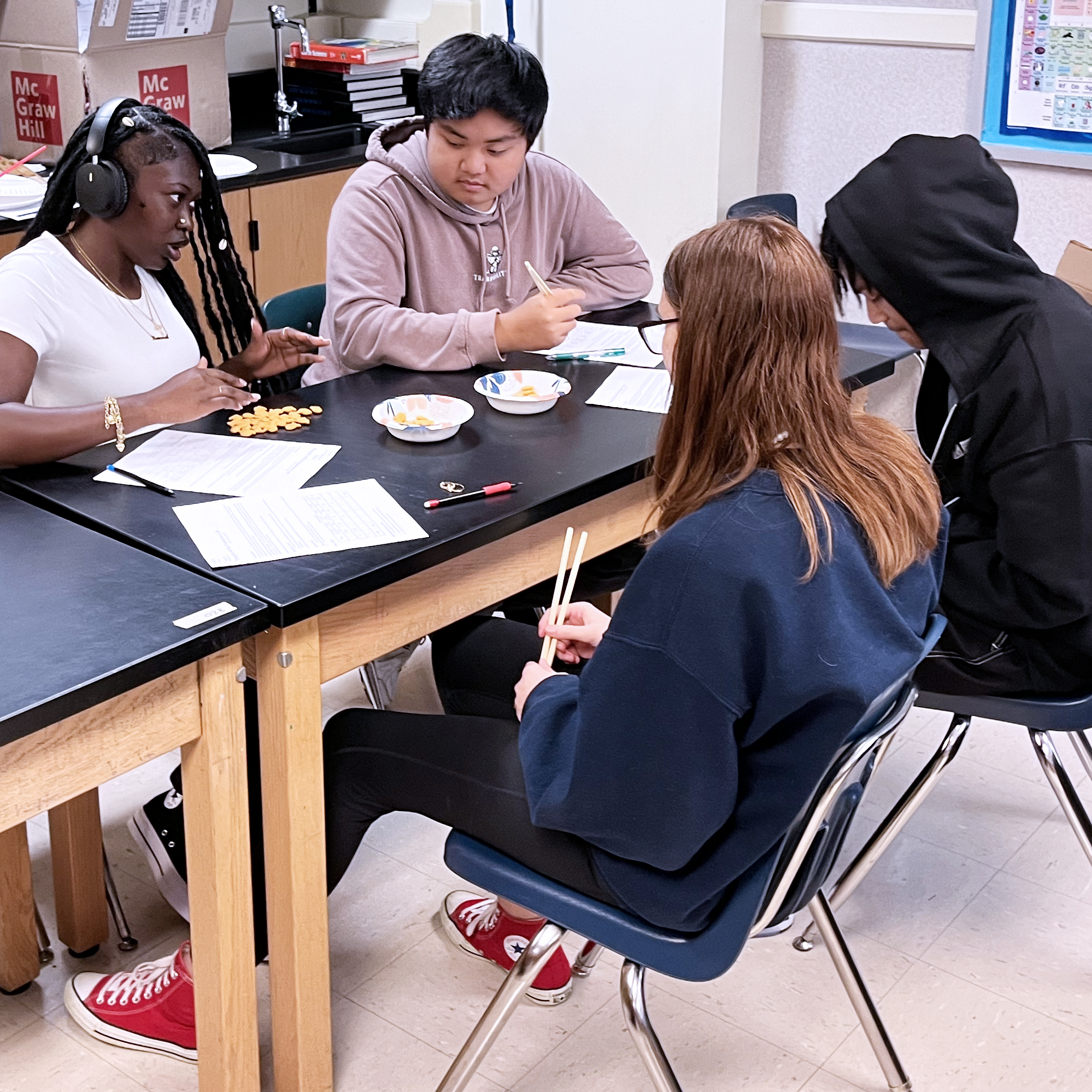 four students working in class