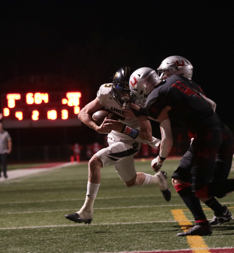 Jackson trucks two uintah defenders on his way into the endzone