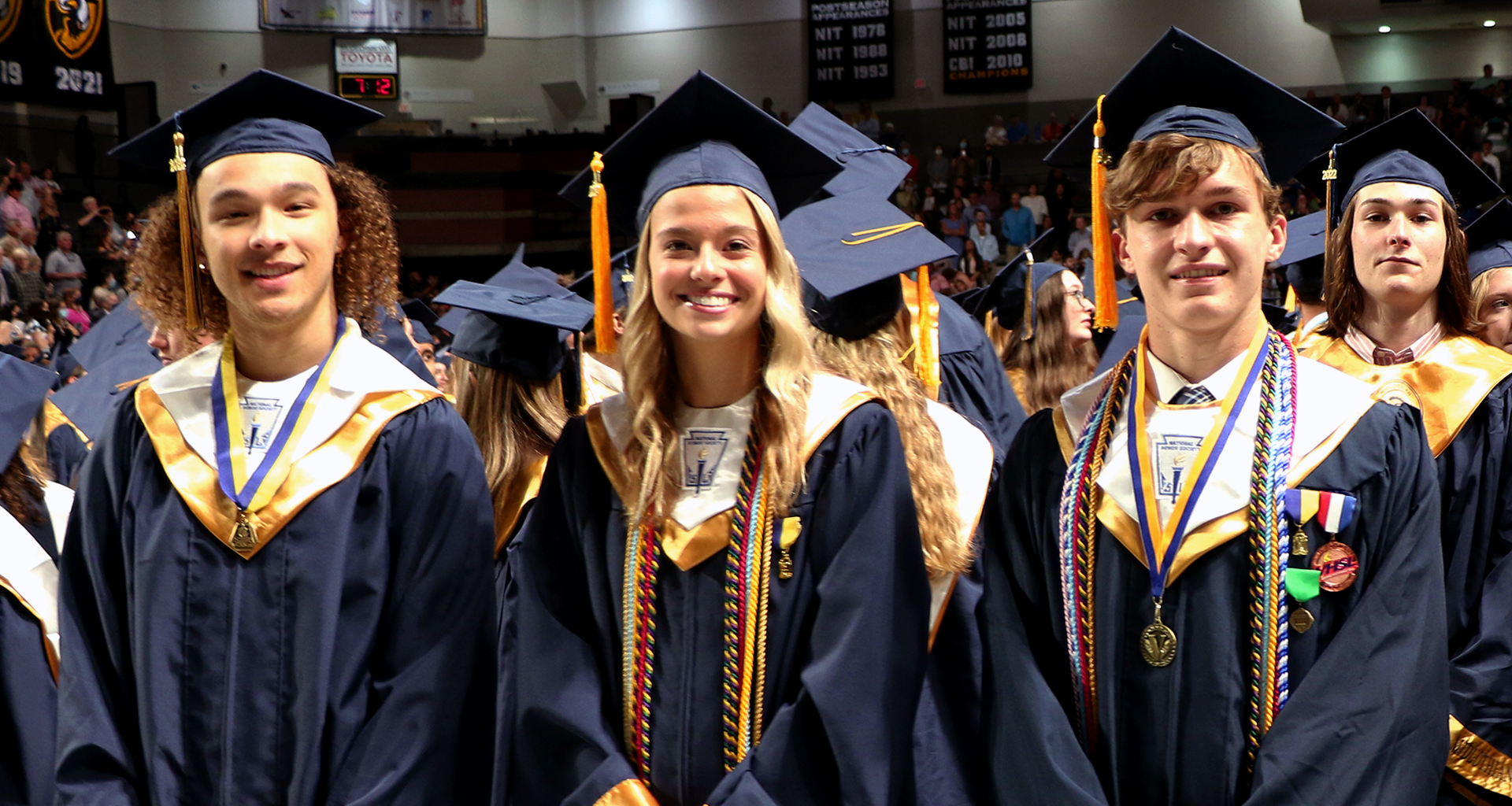 Three high school students during their graduation
