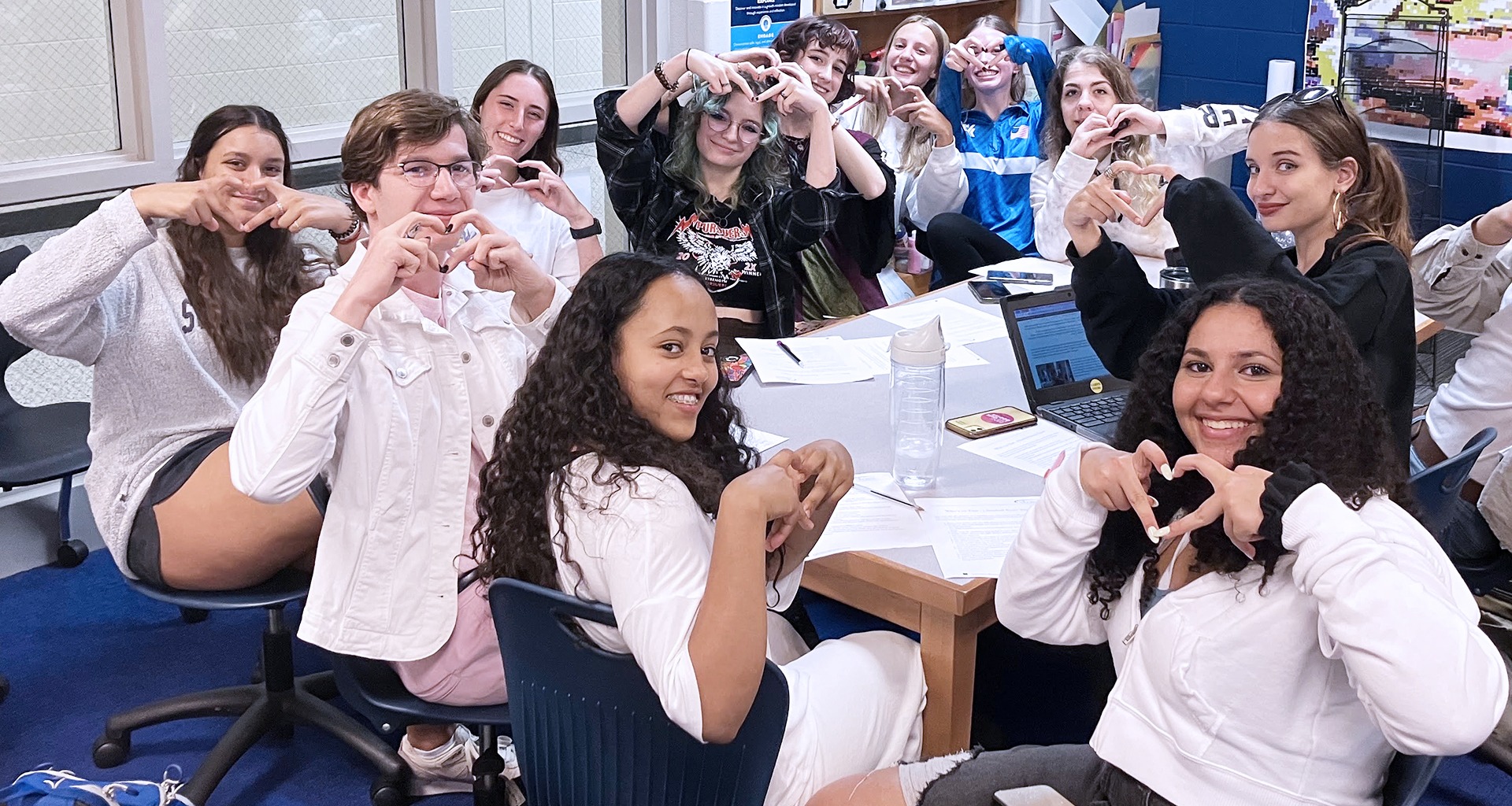 Several students pose for a selfie.