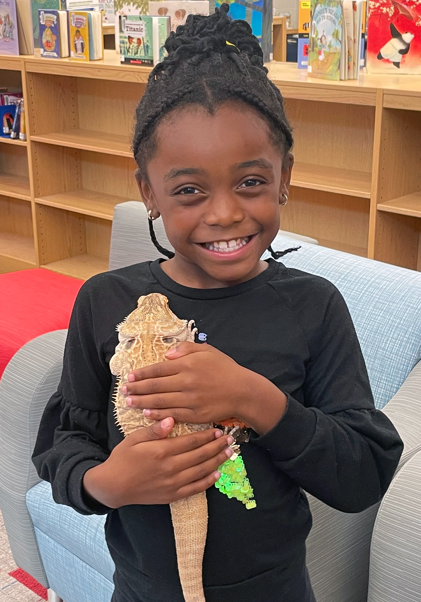 A student holding a lizard