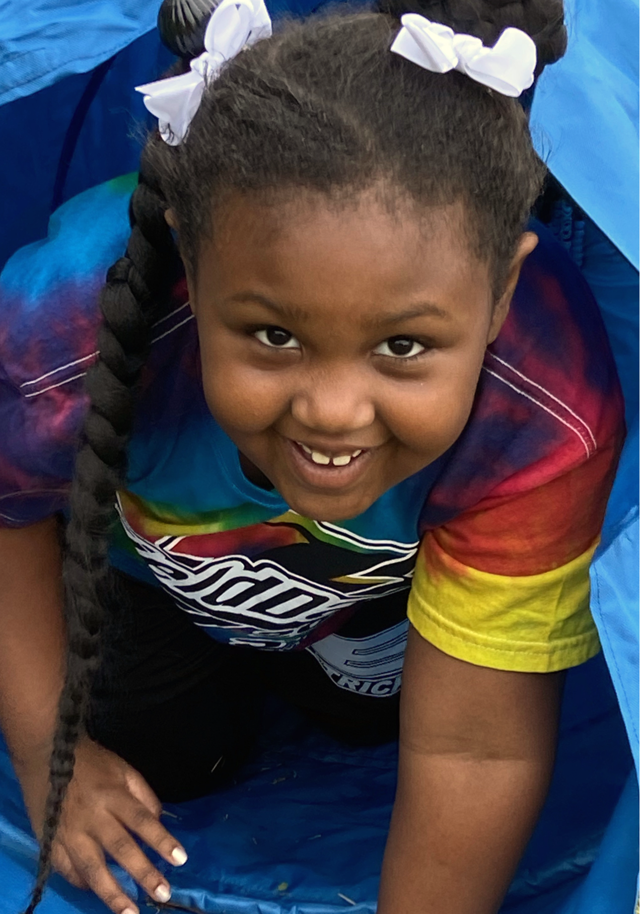 A student playing and crawling