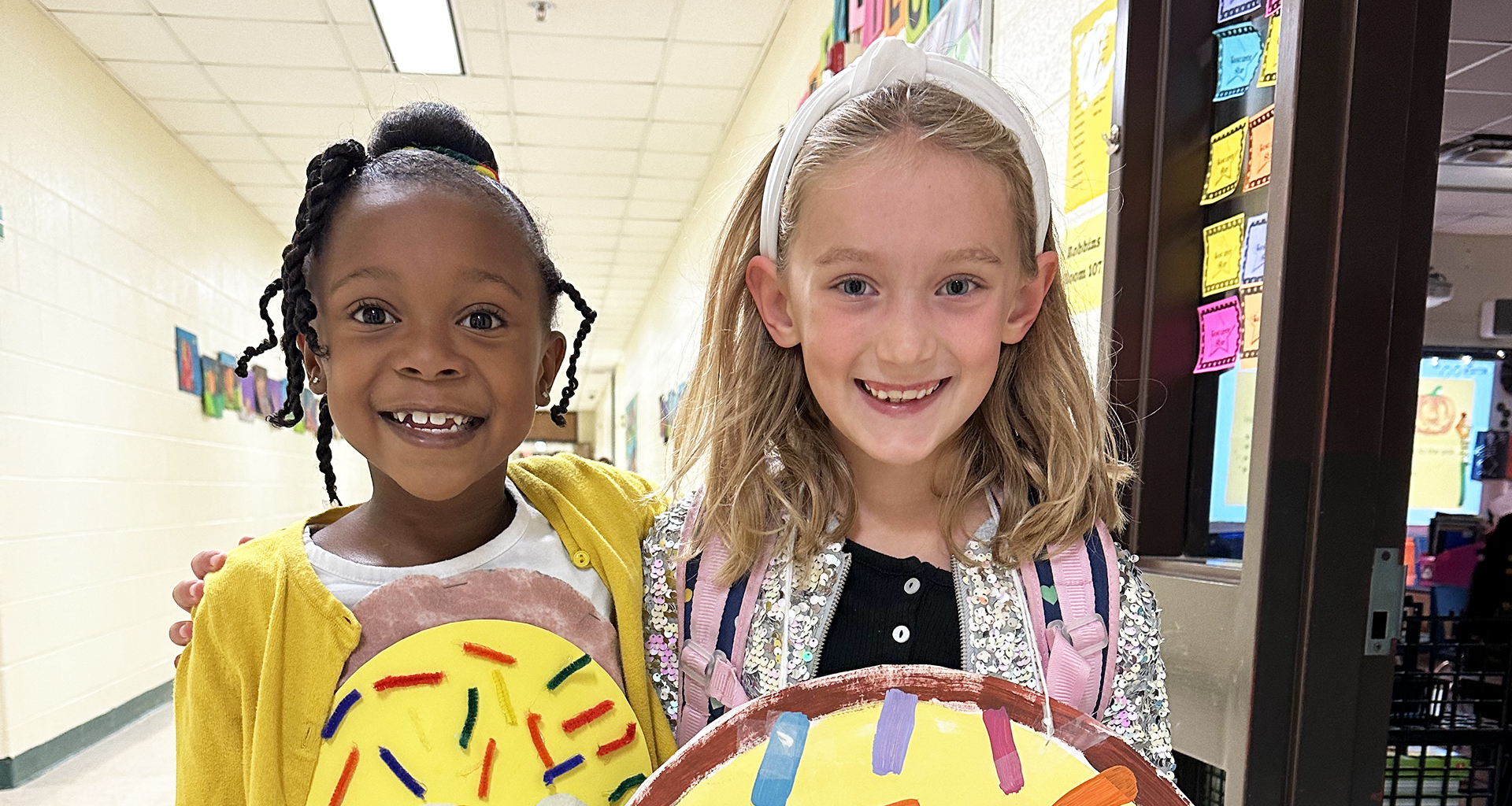 Two students pose for the camera