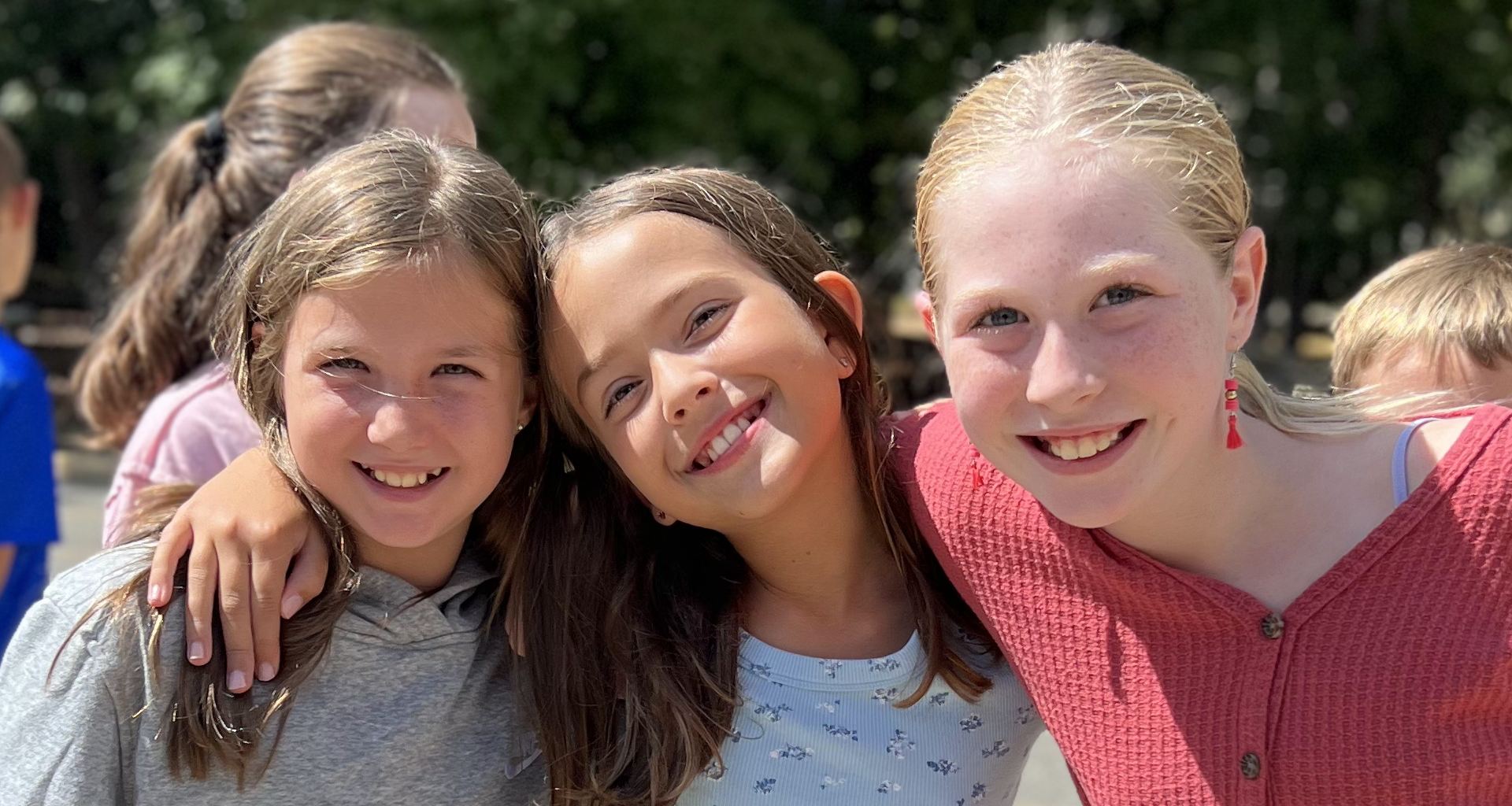 Three students pose for a photo