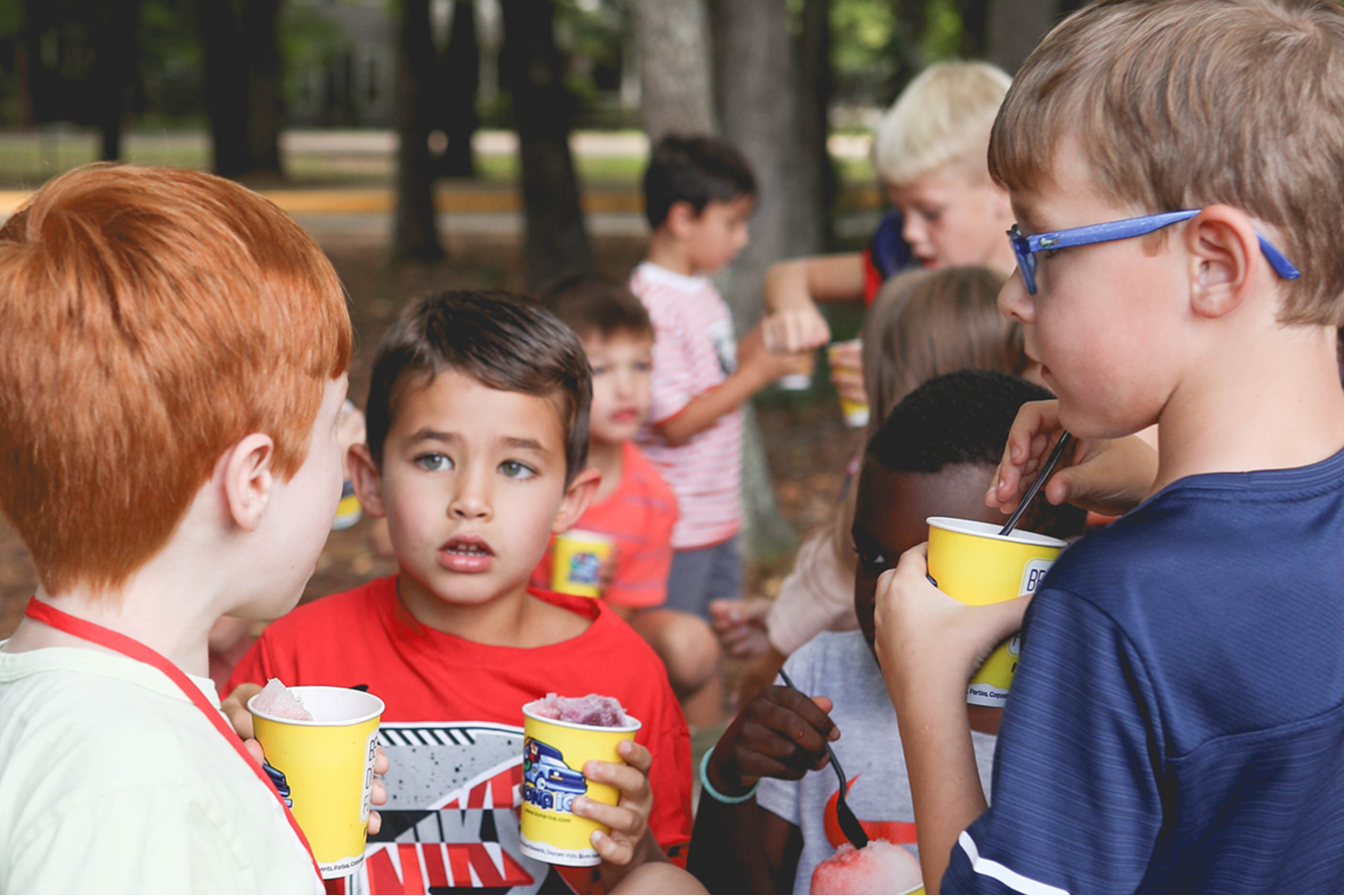 Students outdoors enjoying a treat