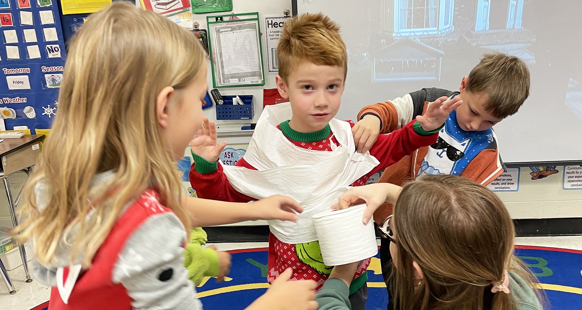 Four students playing a game