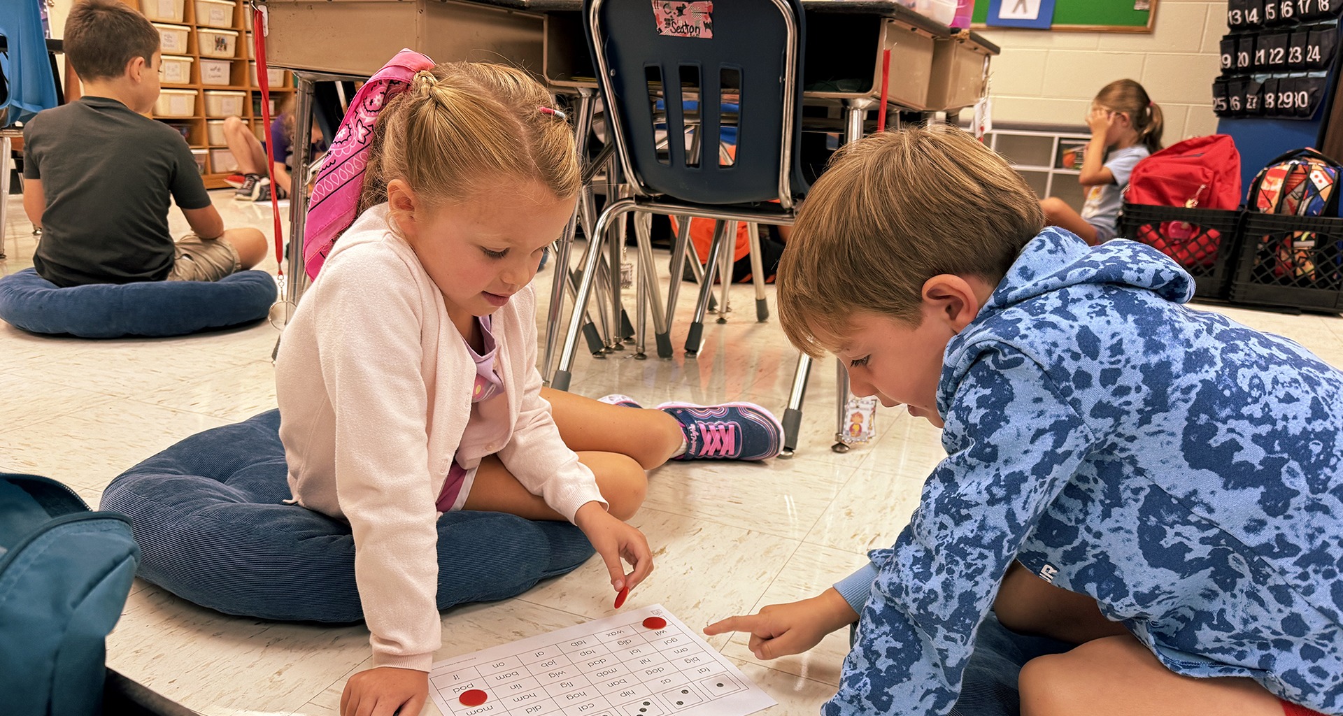 students working in groups on floor cushions