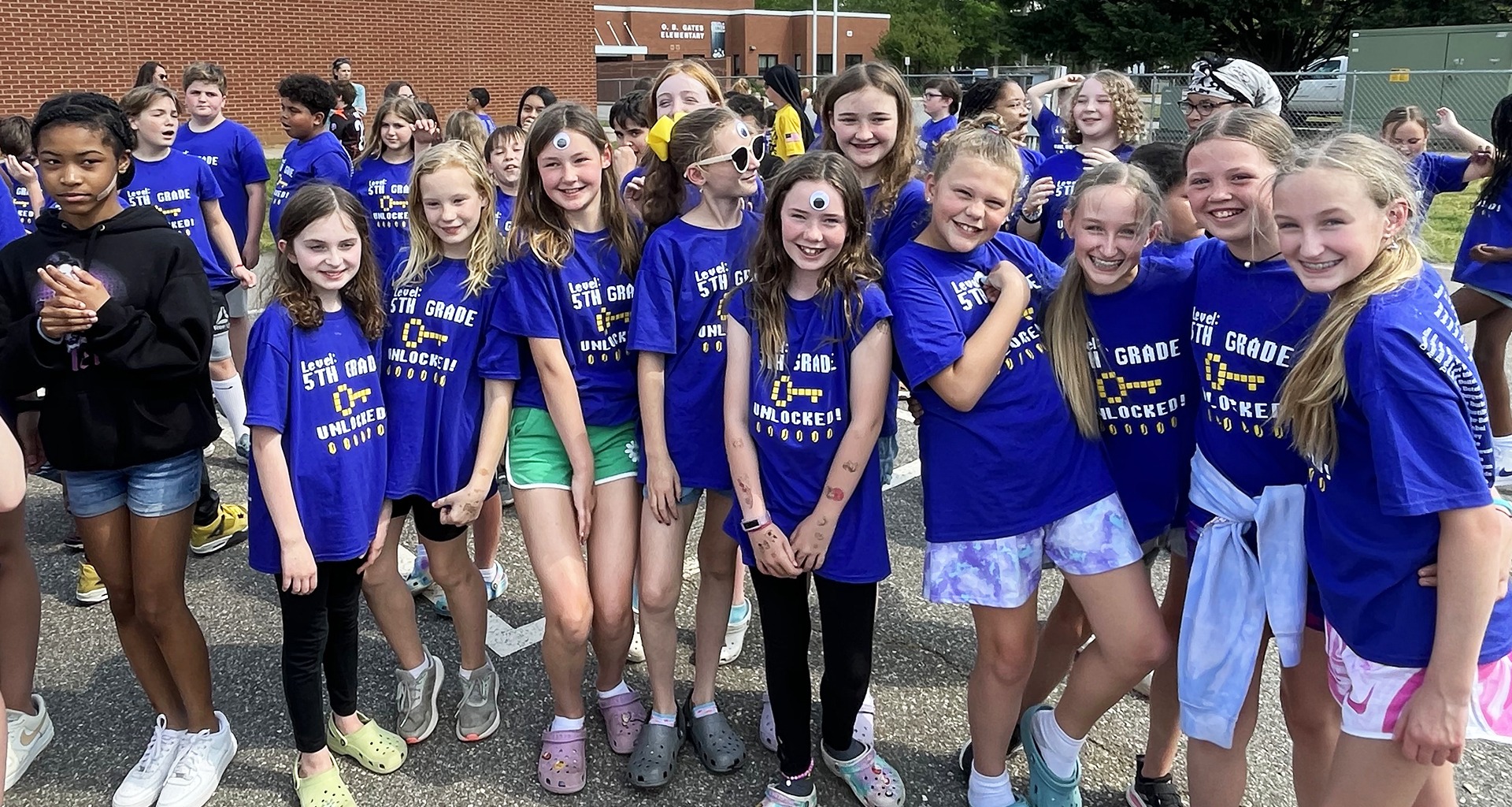 stduents pose for a photo outside