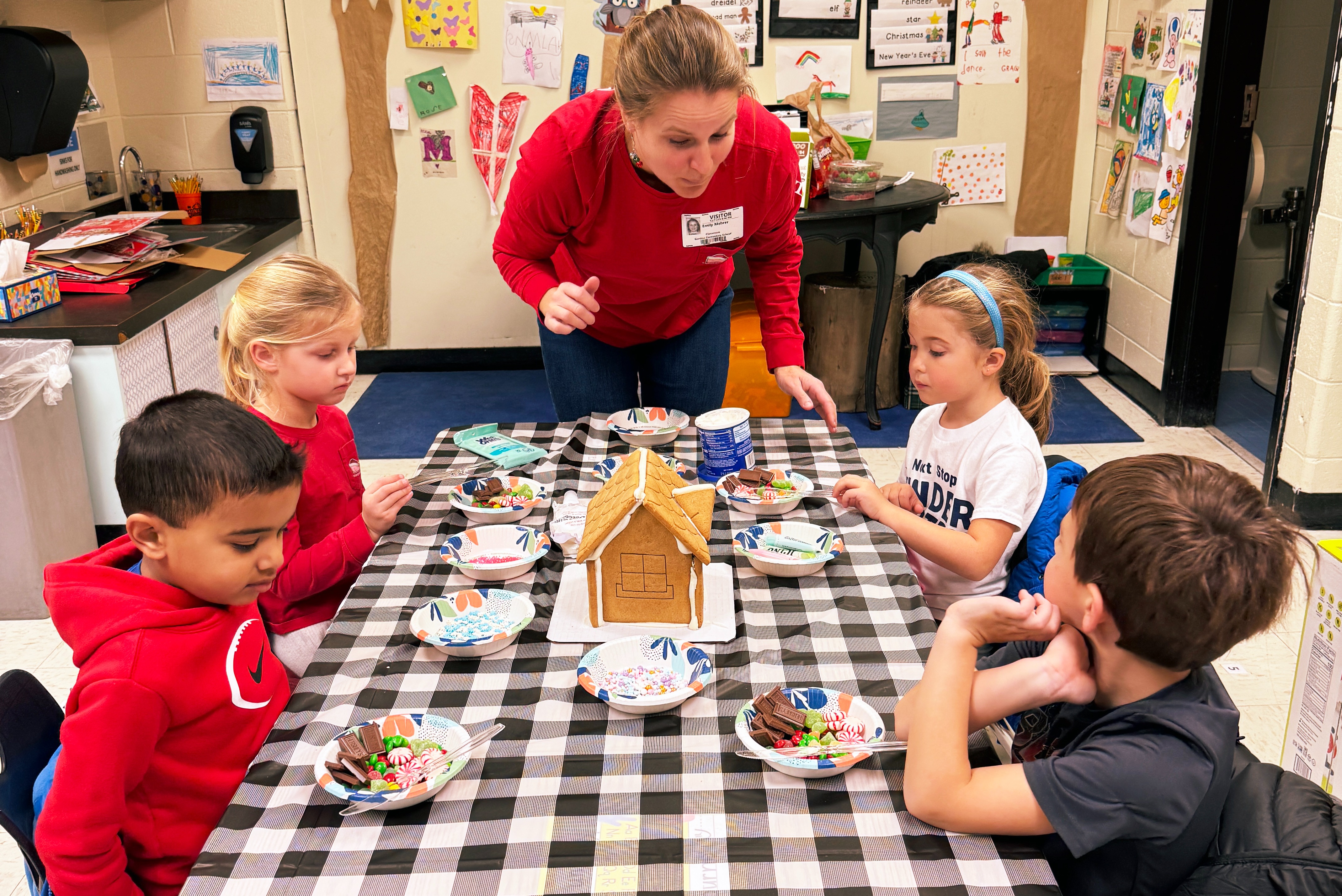 teacher helping students