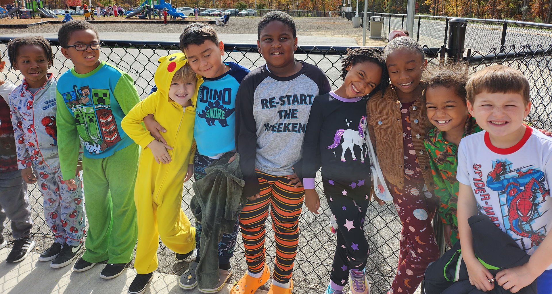 Group of students being silly out on the playground.
