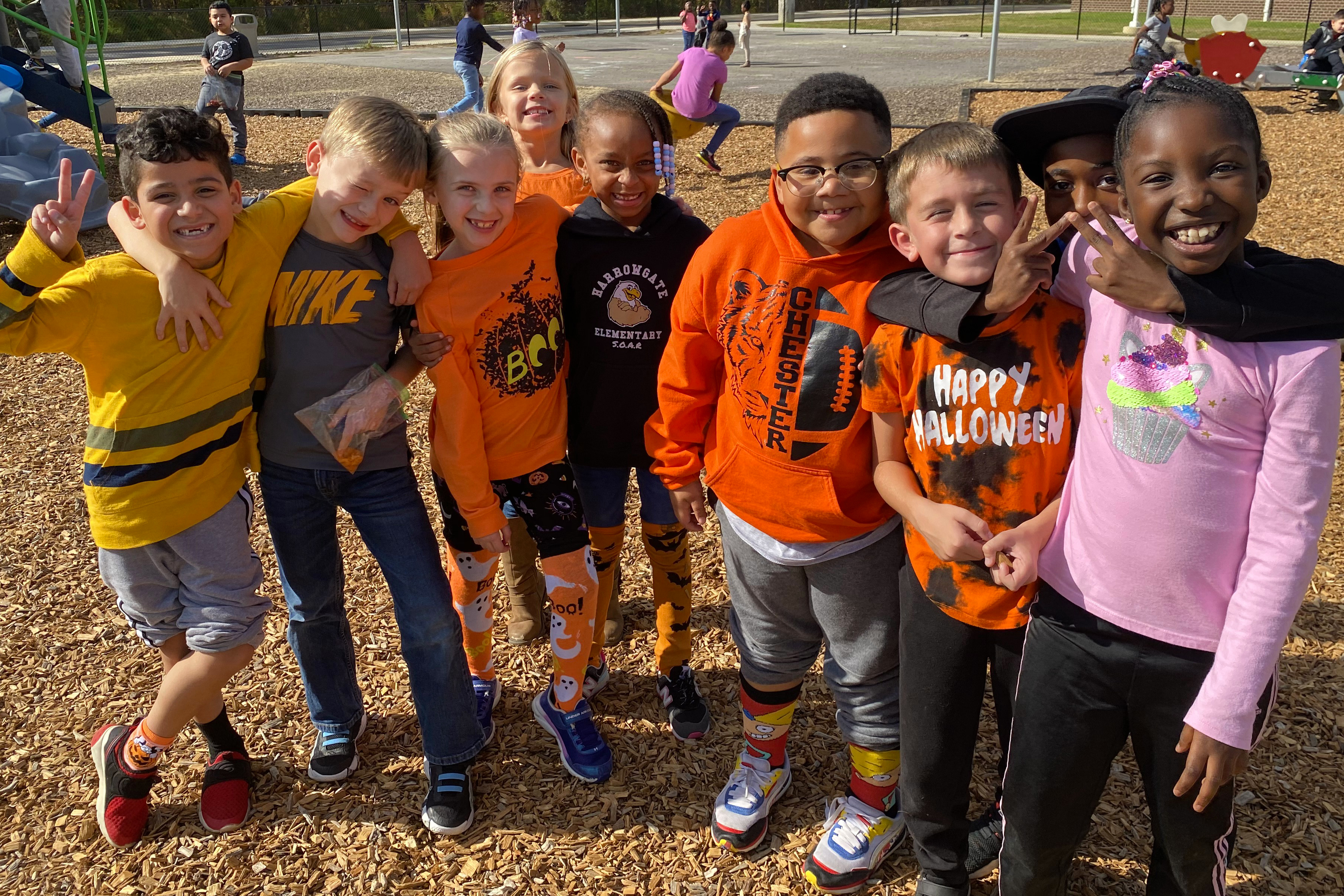 Group of kids being silly on the playground.