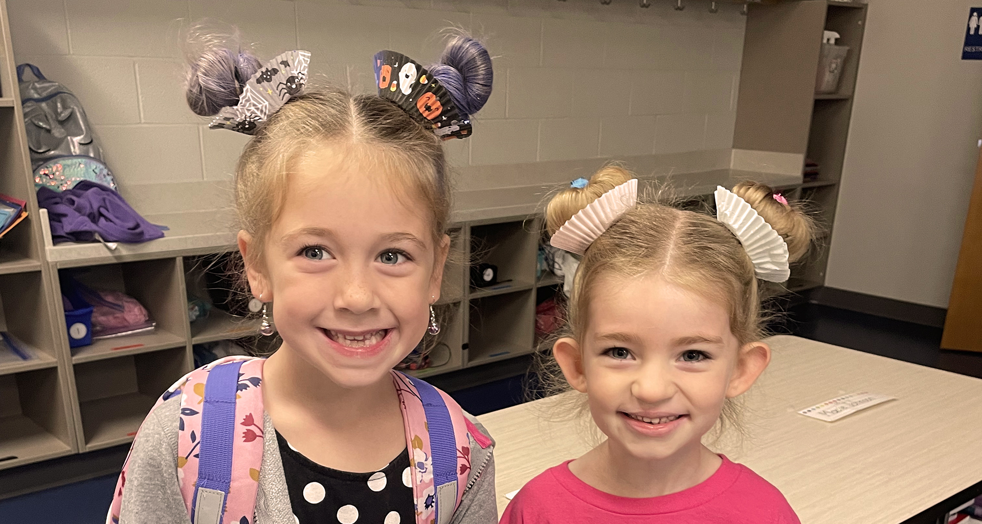 Two young female students in matching pigtails.
