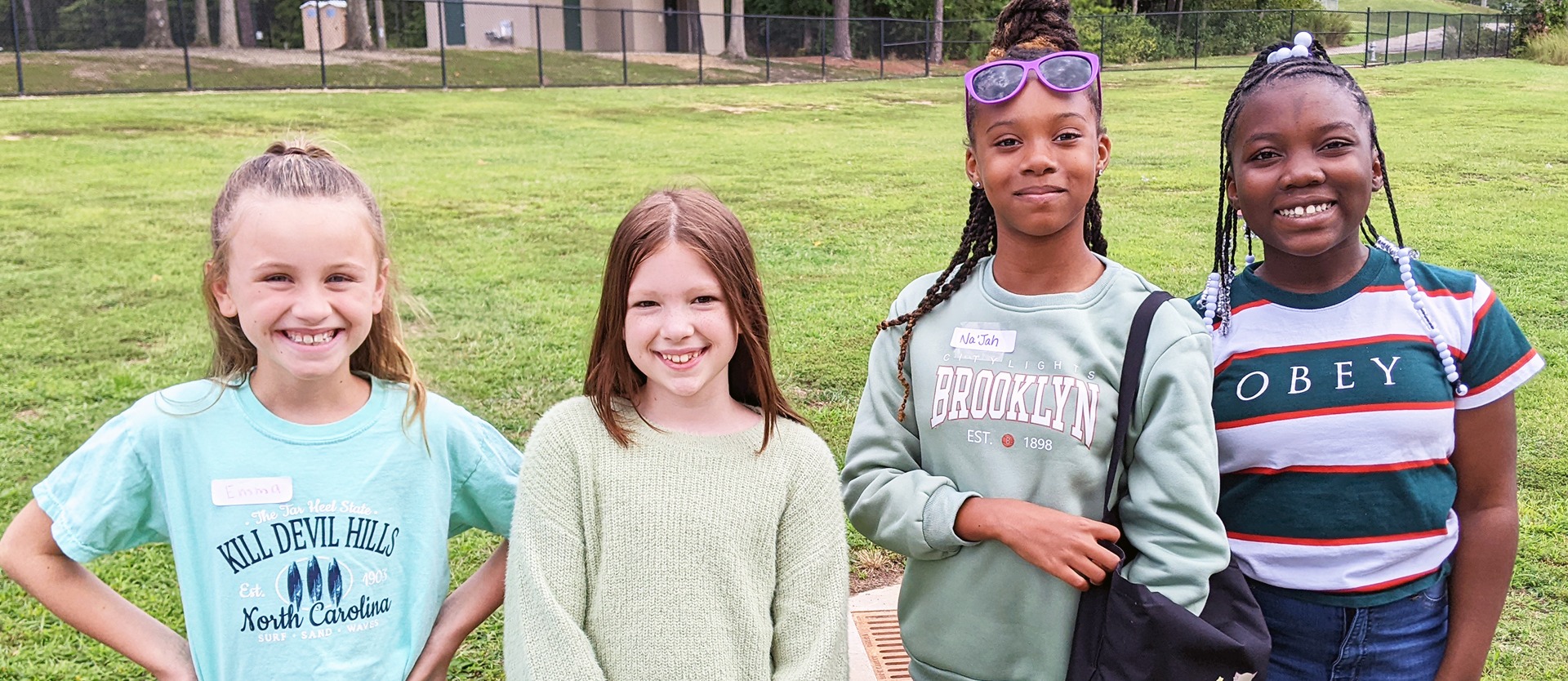 Four female students pose for a photo