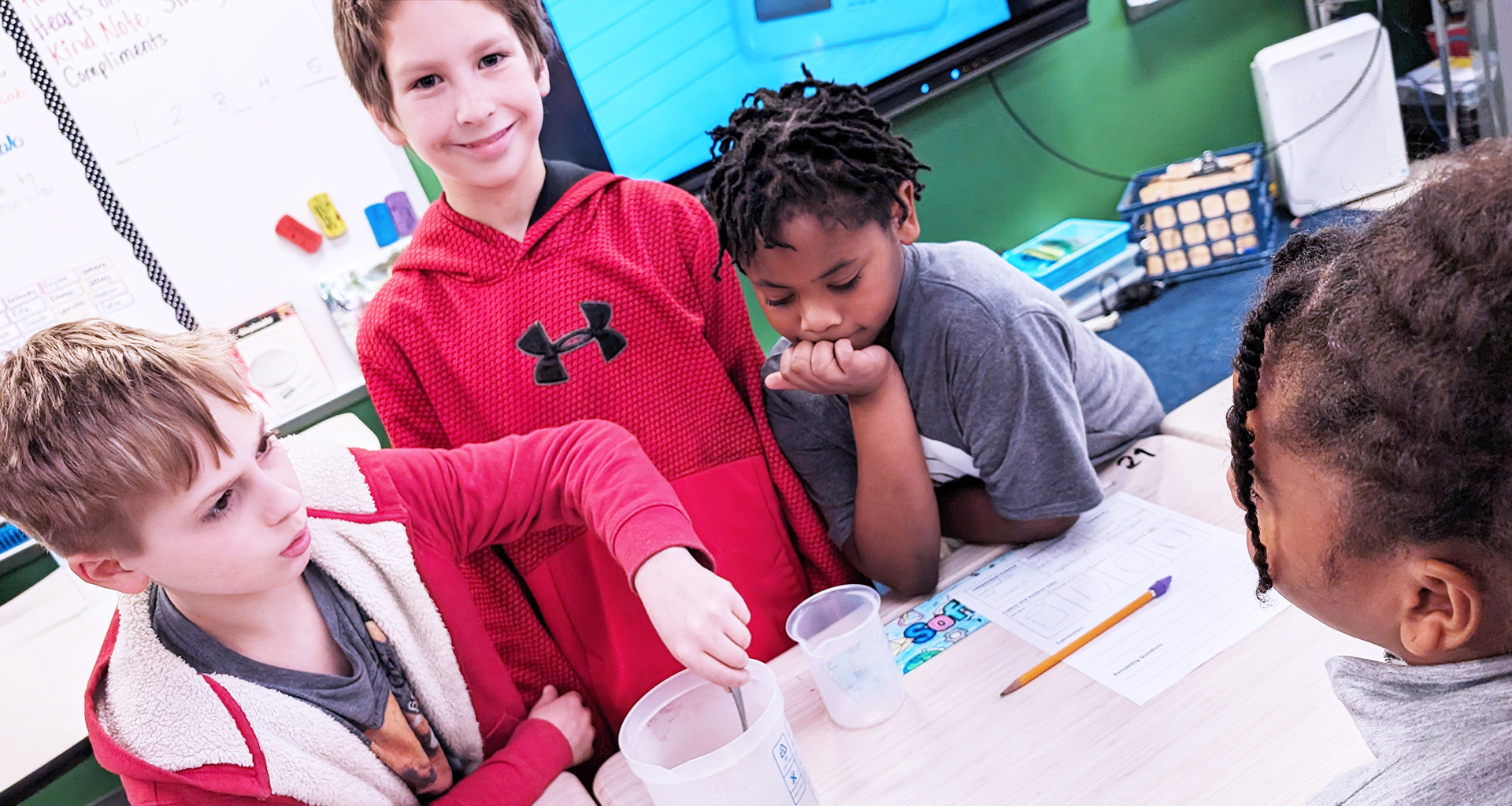 Four students working together in the classroom