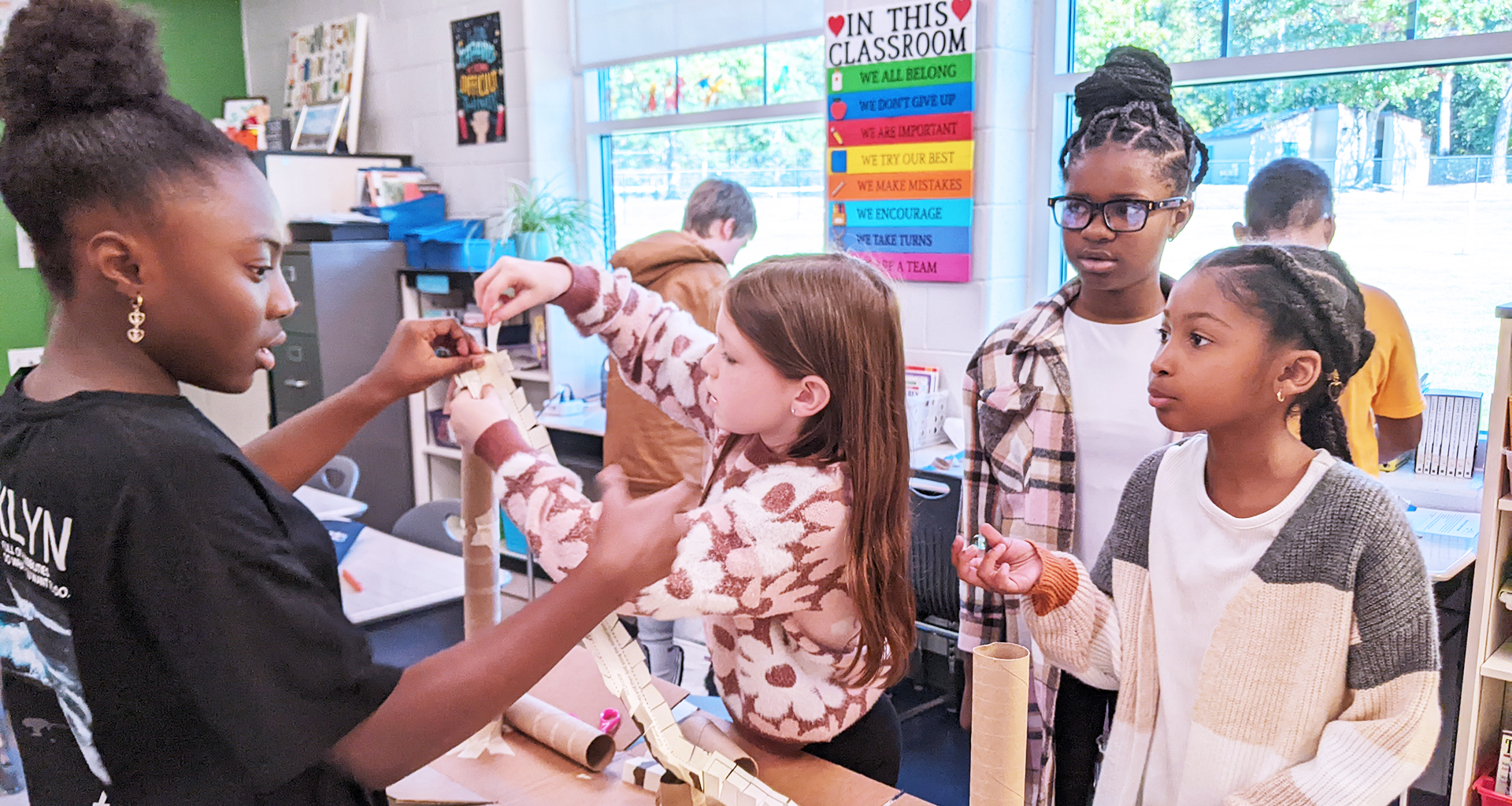 Four student building something in the classroom