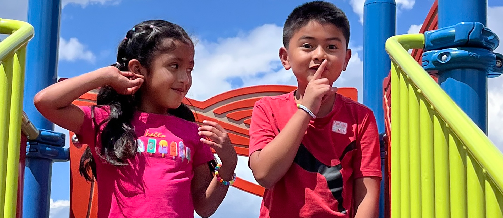 Two students on playground equipment