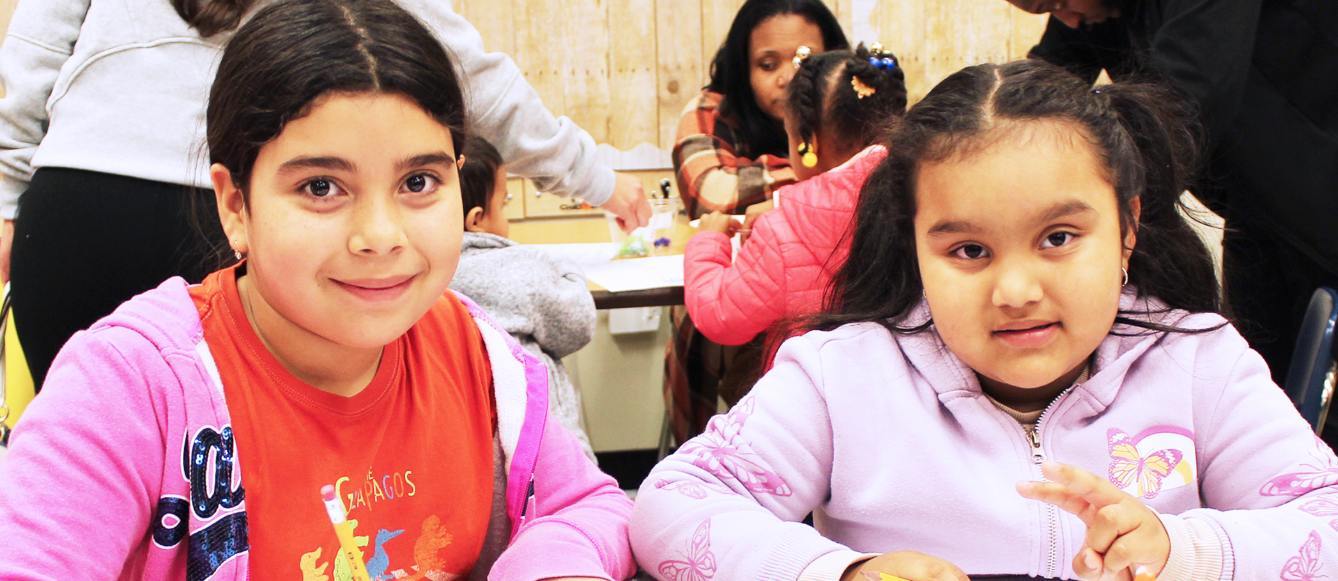 Two students working at a table