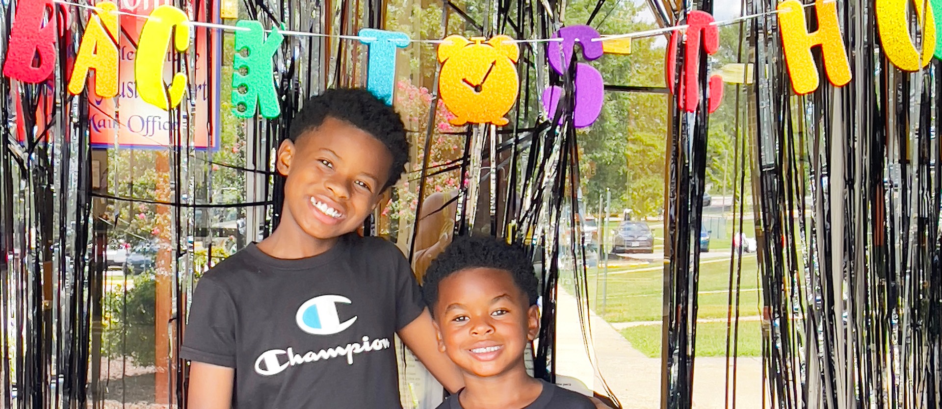 Two students pose for a photo