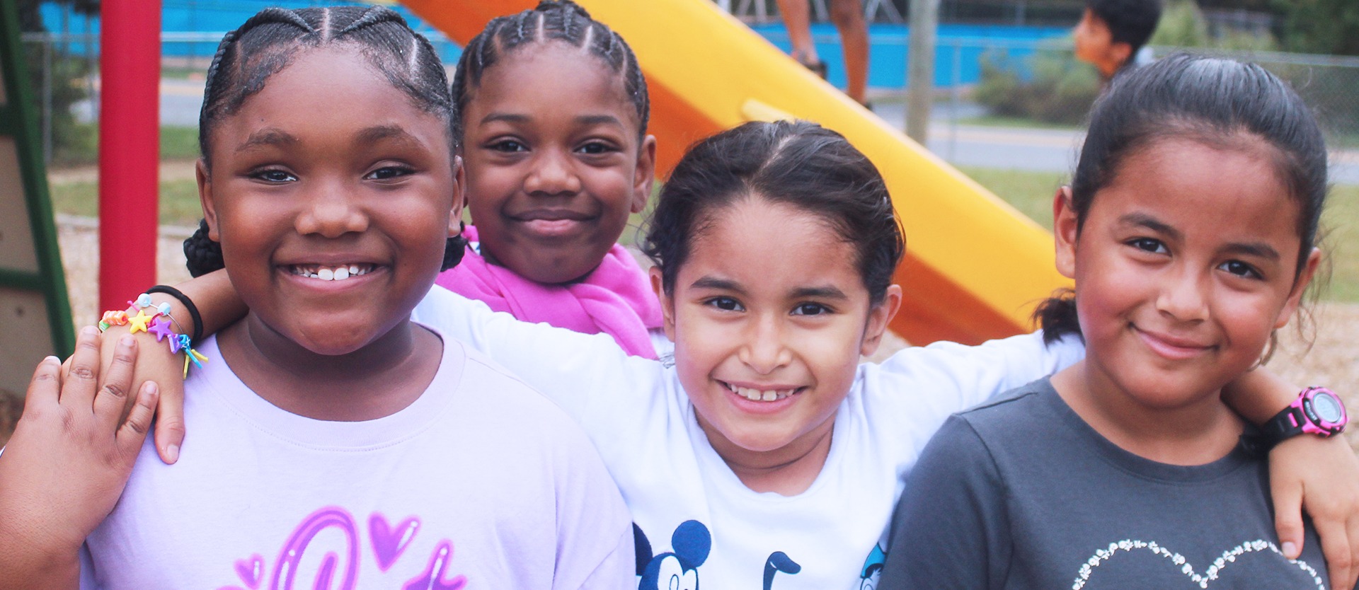 Four students pose for a photo