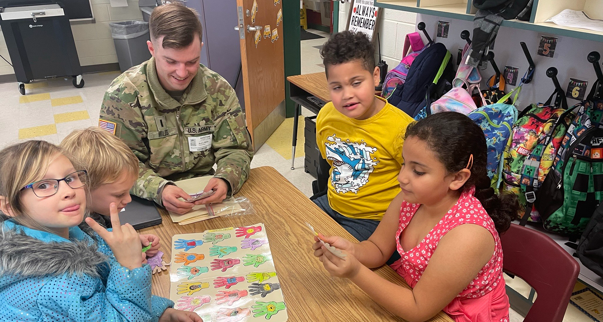 Two students working at their table.