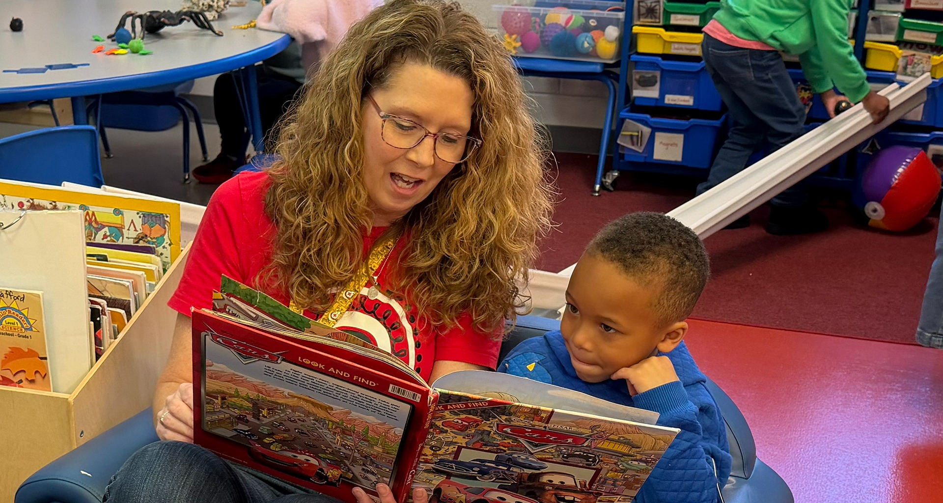 teacher reading to a student