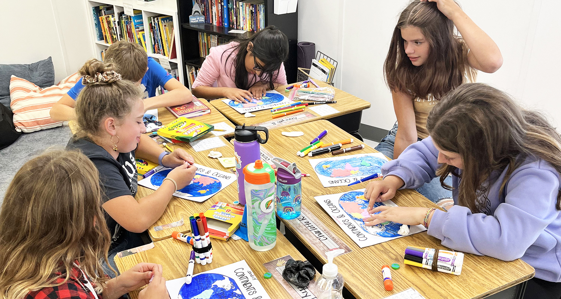 students working on crafts at their desks