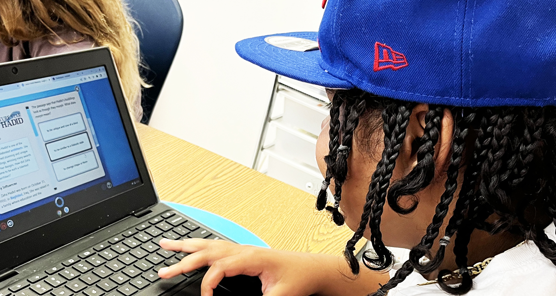 student with Chromebooks