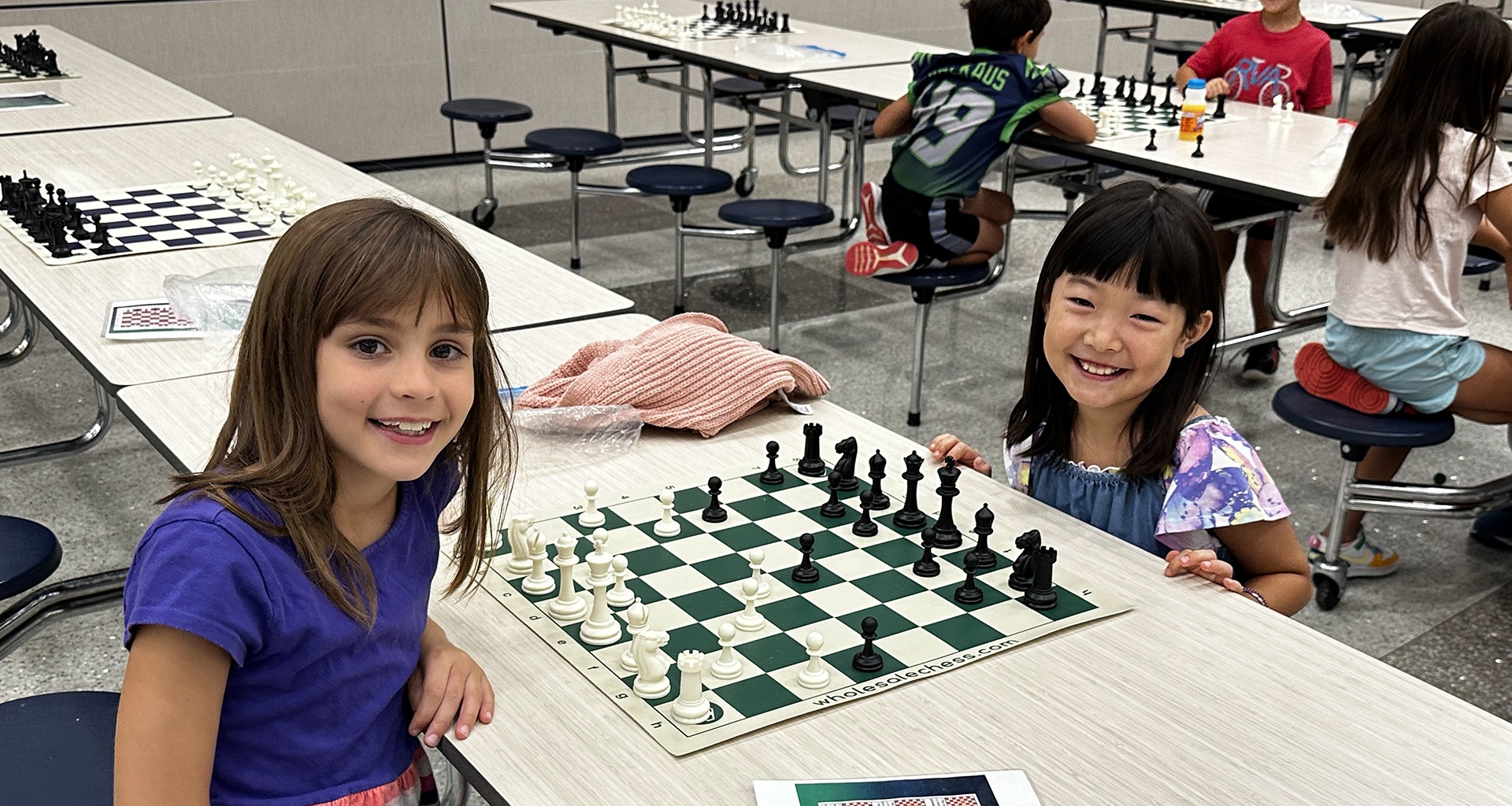 Two students playing chess.