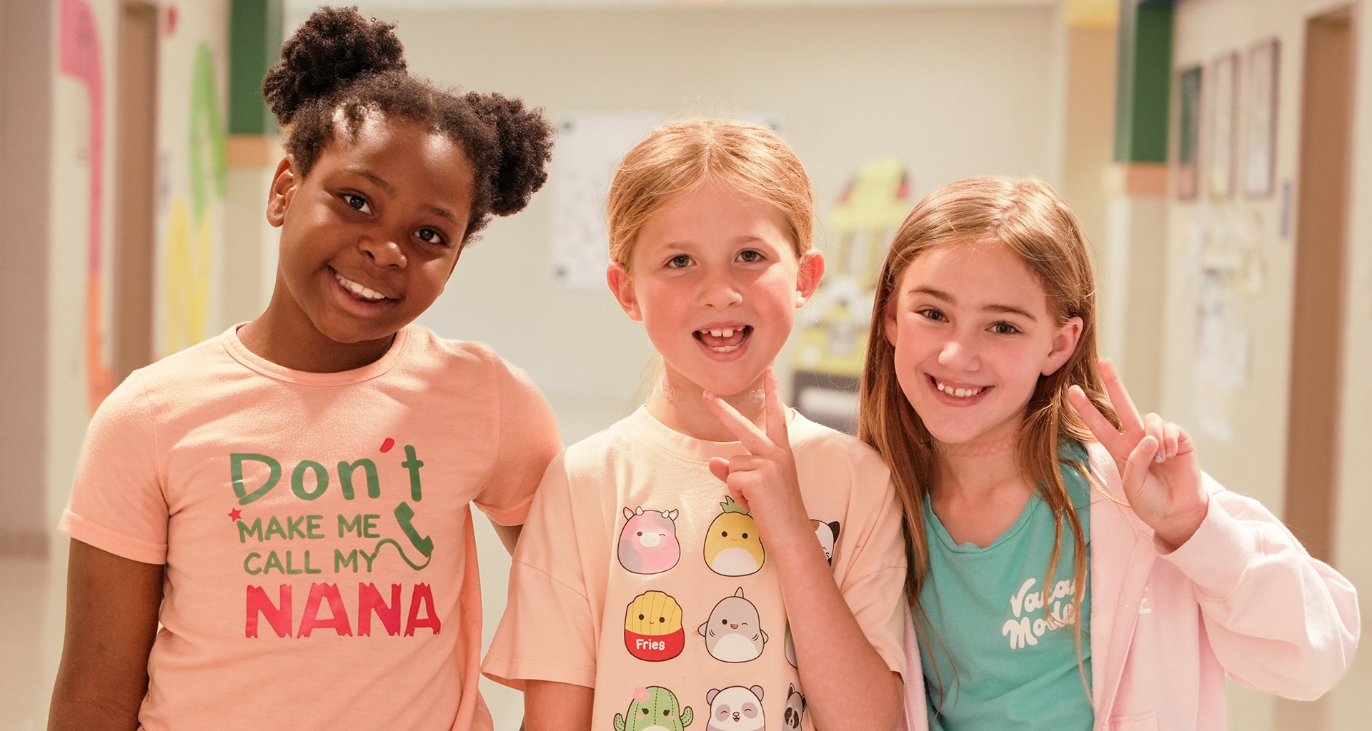 Three students pose for a photo