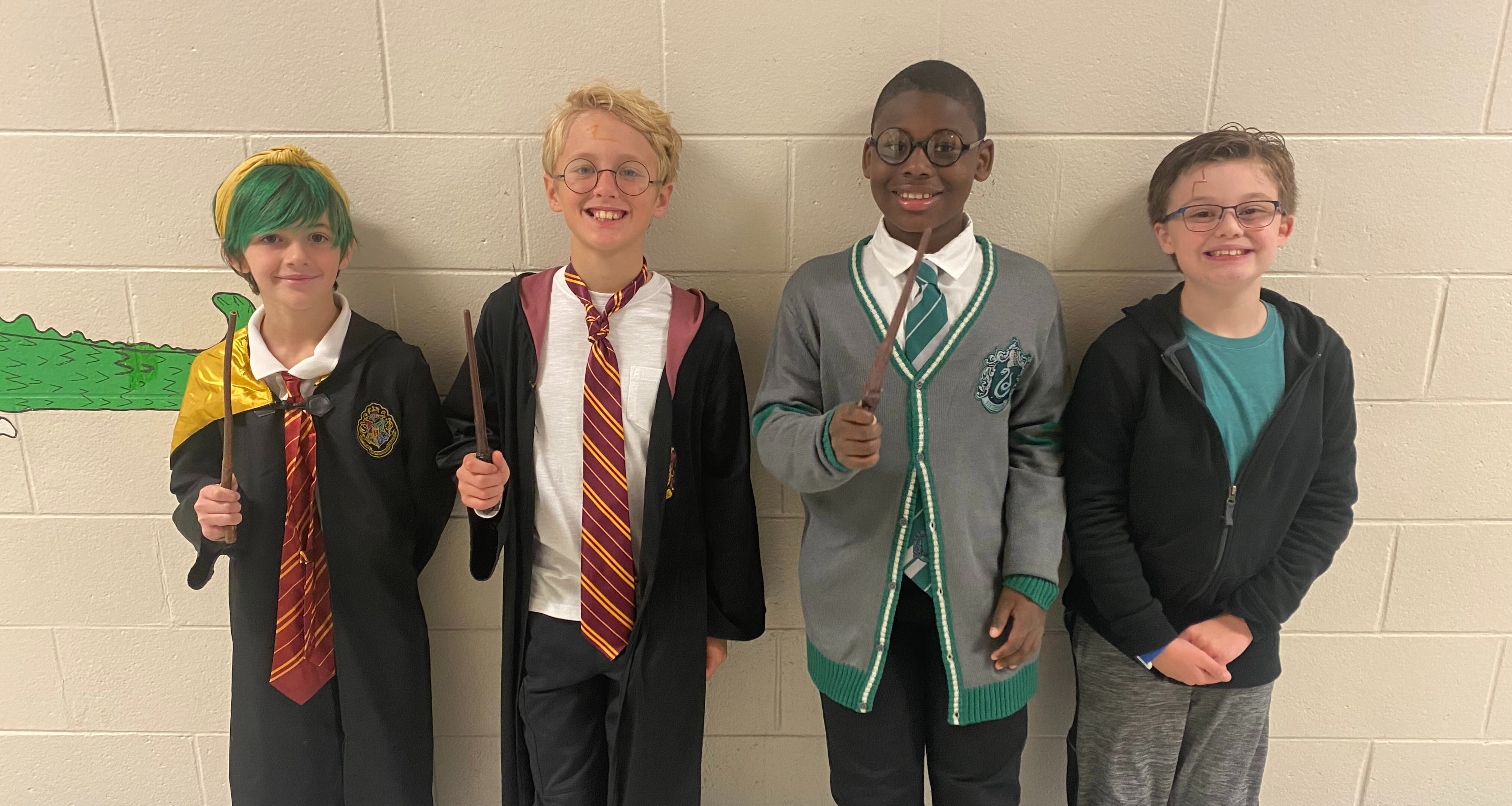 Four students dressed up in Harry Potter attire